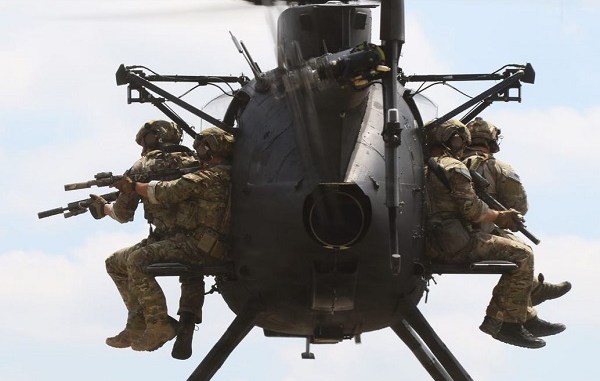 Rangers fly on Little Bird helicopter. USASOC photo (2018).