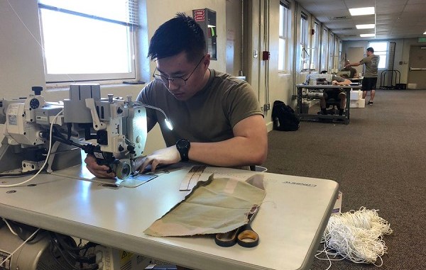 Parachute riggers of 19th Special Forces Group make face masks to combat coronavirus.