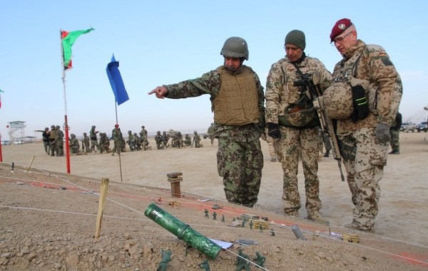 German advisors at TAAC North review a sand table depicting an exercise plan. RS HQs photo February 16, 2018.