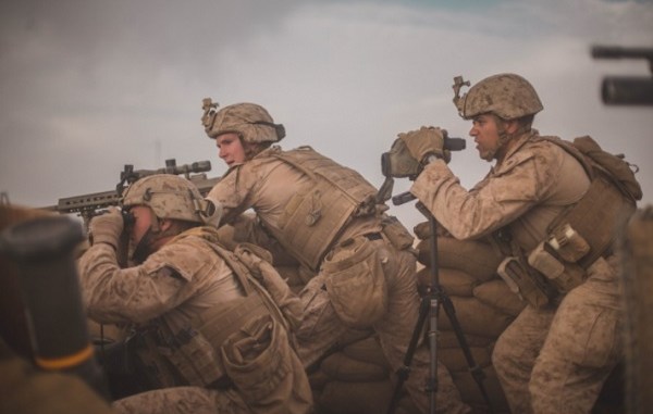 U.S. Marines from Task Force South West react to enemy indirect fire during advising mission with ANA's Operation Maiwand 12 at Camp Shorsrack, Afghanistan. (Photo by SGT Conner Robbins, USMC, March 9, 2018.)