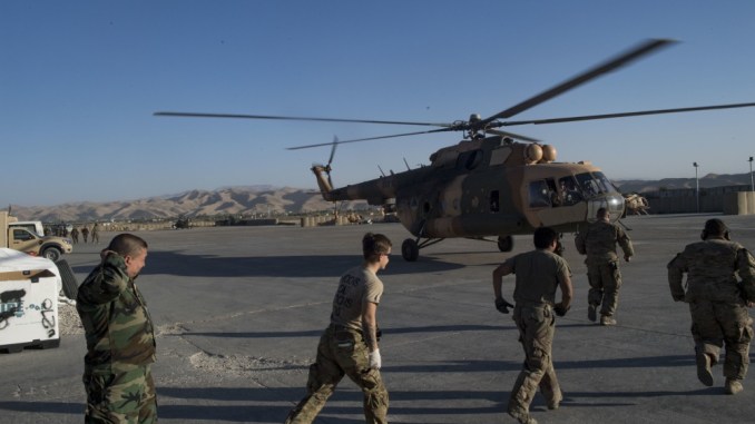 Medical team members rush to an Afghan Mi-17 helicopter with wounded soldiers. The ANA 209th Corps abandoned Camp Gormach, Faryab province. Photo by SrA Nicholas Dutton, USAF, RS HQs.