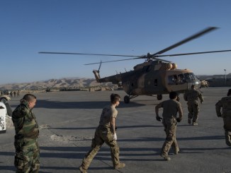 Medical team members rush to an Afghan Mi-17 helicopter with wounded soldiers. The ANA 209th Corps abandoned Camp Gormach, Faryab province. Photo by SrA Nicholas Dutton, USAF, RS HQs.