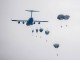 Paratroopers descend from a US Air Force cargo transport. (Photo USAF December 1, 2017).