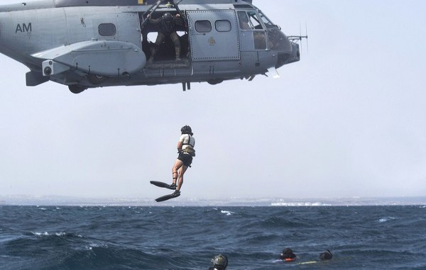 Pararescuemen of 82nd Expeditionary Rescue Squadron jump out of French SA 330 Puma helicopter during PR training in Gulf of Aden, off the coast of Djibouti on August 13,2 018. USAF photo by Senior Airman Haley D. Phillips.