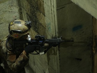 Student in the Advance Operators Training Course (AOTC) clears a room in live fire shoot house in Baghdad, Iraq on December 19, 2019. Photo by SGT Brandon Franklin, 10th SFGA.