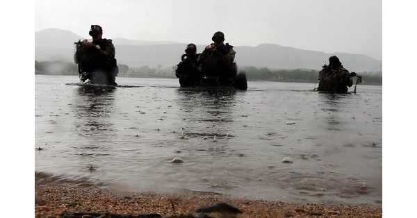 Combat Divers emerge from water