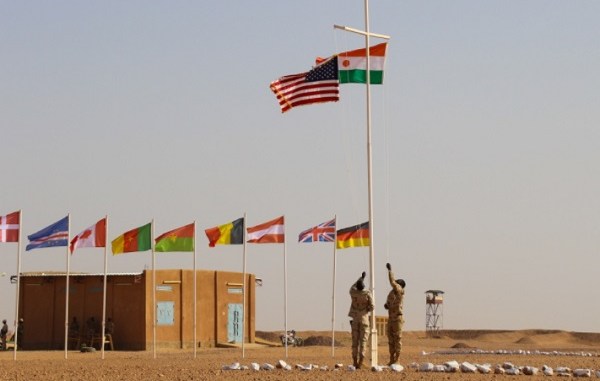 The Nigerien and American flags are raised at the opening ceremony of Flintlock 2018 at Agadez, Niger. (photo Capt Eric Smith, AFRICOM, April 11, 2018).