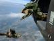 Personnel from Special Operations Command Europe (SOCEUR) perform a high altitude low opening (HALO) parachute jump from a U.S. Army Sikorsky UH-60 Black Hawk helicopter at 12,000 feet in Stuttgart, Germany. (U.S. Army photo by SPC Jason Johnston, 18 Aug 2016).