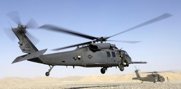 Helicopter crash in Iraq - A HH-60 Pave Hawk helicopter prepares to land in Kandahar, Afghanistan while a U.S. Army MEDEVAC helicopter takes on wounded personnel. (photo by Senior Airman Brian Ferguson, USAF).