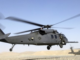 Helicopter crash in Iraq - A HH-60 Pave Hawk helicopter prepares to land in Kandahar, Afghanistan while a U.S. Army MEDEVAC helicopter takes on wounded personnel. (photo by Senior Airman Brian Ferguson, USAF).