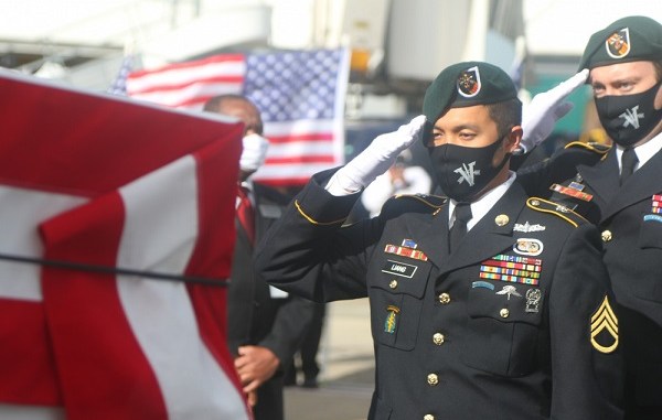 Green Berets, assigned to 5th Special Forces Group (Airborne), conduct a dignified transfer for the final flight of Medal of Honor recipient, Command Sgt. Maj. (Retired) Bennie G. Adkins, to his resting place at Arlington National Cemetery, 14 Dec. Adkins, died due to complications with COVID-19 in April.