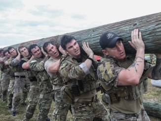 Soldiers assigned to 1st Special Forces Group conduct a log carry drill during an endurance event at Torii Station, Okinawa, Japan. (photo by SSG Kwadwo Frimpong, Nov 30, 2017).