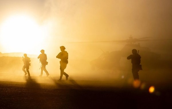 Marine Raiders disembark from helicopter during vehicle interdiction mission.