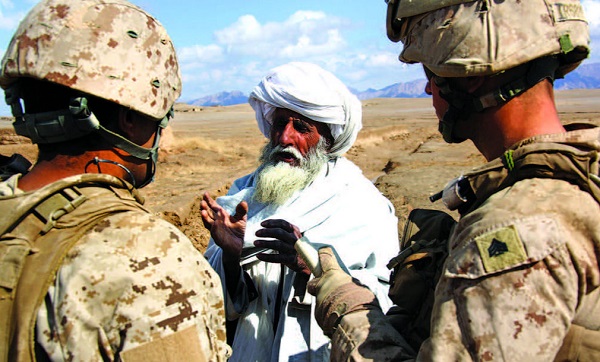 Marines talking with Afghan elder in Helmand province. Photo by Gunnery Sergeant Bryce Piper, USMC, 2011. Photo in July 2018 SIGAR report.