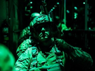 Soldier from the 10th Special Forces Group at Fort Carson, Colorado prepares for a night static line parachute jump from a C-130 aircraft. (Photo by SGT Connor Mendez, U.S. Army, October 24, 2017).