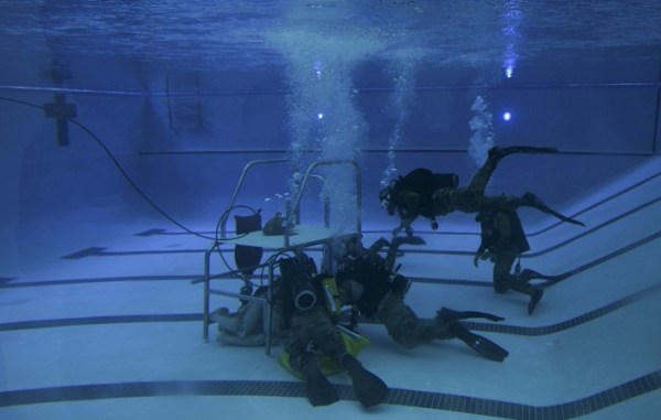 Special Tactics Airmen in pool dive training. Photo by Airman 1st Class Dennis Spain, 1st Special Operations Wing Public Affairs, Hurlburt Field, Florida, July 17, 2018.