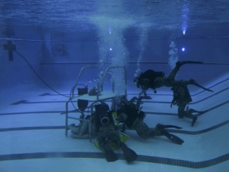 Special Tactics Airmen in pool dive training. Photo by Airman 1st Class Dennis Spain, 1st Special Operations Wing Public Affairs, Hurlburt Field, Florida, July 17, 2018.