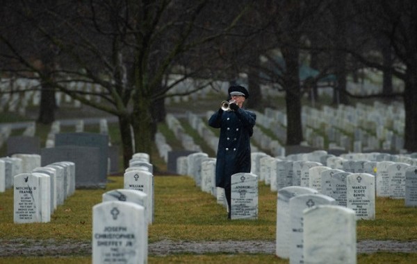 An Air Force bugler plays taps during the military funeral honors of Air Force Staff Sgt. Dylan Elchin, a Special Tactics combat controller assigned to the 26th Special Tactics Squadron, at Arlington National Cemetery, Va., Jan. 24, 2019. As a Special Tactics combat controller, Elchin was specially trained and equipped for immediate deployment into combat operations to conduct global access, precision strike, and personnel recovery operations. (U.S. Air Force photo by Senior Airman Joseph Pick)