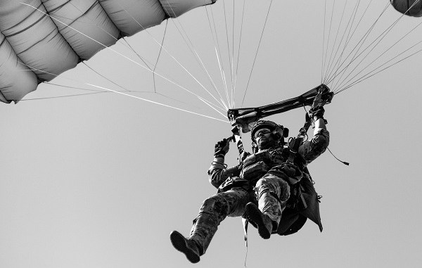 A U.S. Army Green Beret assigned to 19th Special Forces Group lands during a military freefall operation near Cincu, Romania while participating in Trojan Footprint 19. (SOCEUR, June 2019).