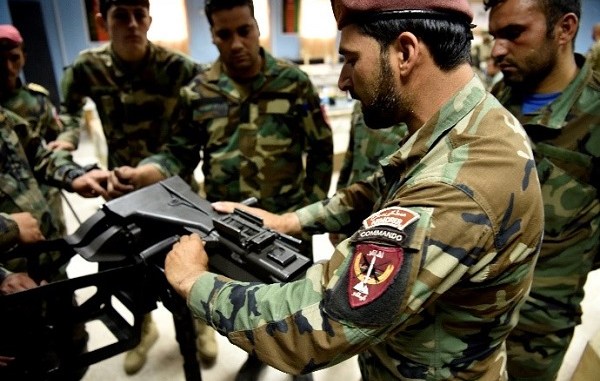 weapons maintenance and repair facility - ANASOC instructor demonstrates how to do a function check on a MK 19, 40 mm grenade launcher at Camp Commando, Kabul, Afghanistan. (NSOCC-A photo by MSG Felix Figueroa).