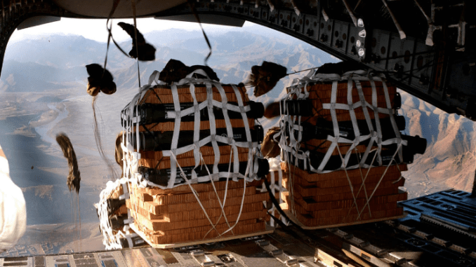 C17 bundle drop over a remote U.S. camp in Afghanistan. (Photo by Senior Airman Ricky J. Best, 2 Jan 2007).