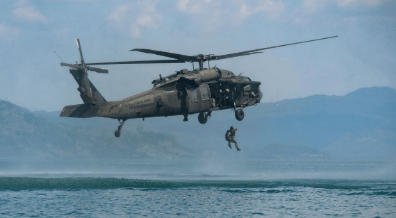 A Salvadoran Special Forces Soldier helocasts from a UH-60 Blackhawk in Dec 2016 during Operation Serpiente (photo by MSG Kerri Spero, JTF Bravo).