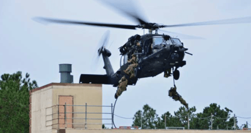 SOF Operators helicasting onto a rooftop (photo from USSOCOM 2016 Factbook)