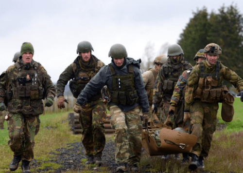 Medics carry simulated wounded during combat lifesaver training at NATO ISTC NSOCM Course (Photo Credit: Jason Johnston).