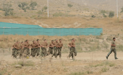 Cadets running at the ANAOA. (Photo by SSG Richard Andrade, ISAF, 23 Oct 2013).